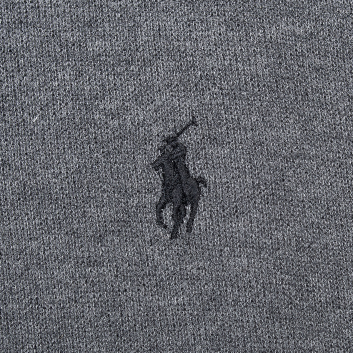 Black Polo pony embroidery detail on dark grey sweater