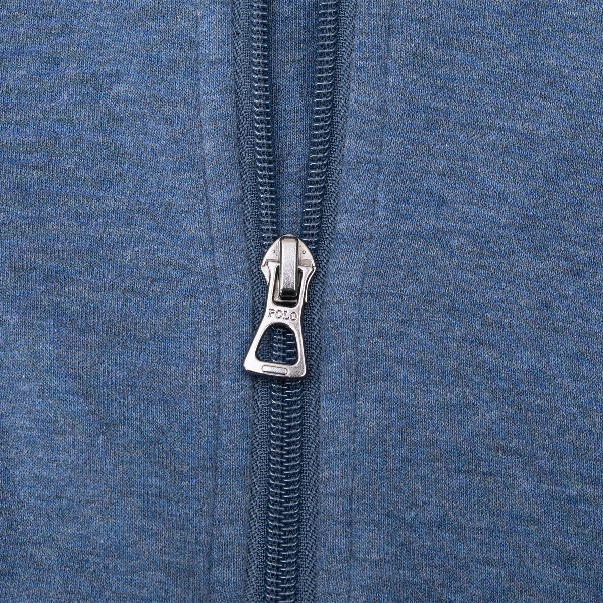 Close-up of Polo zipper pull on blue quarter-zip sweater
