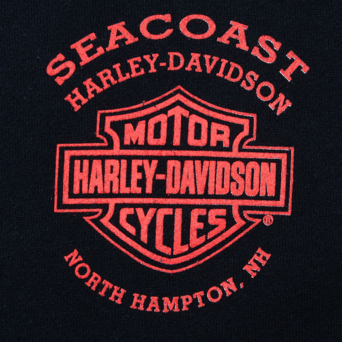 Red Seacoast Harley-Davidson North Hampton, NH chest print on black fabric