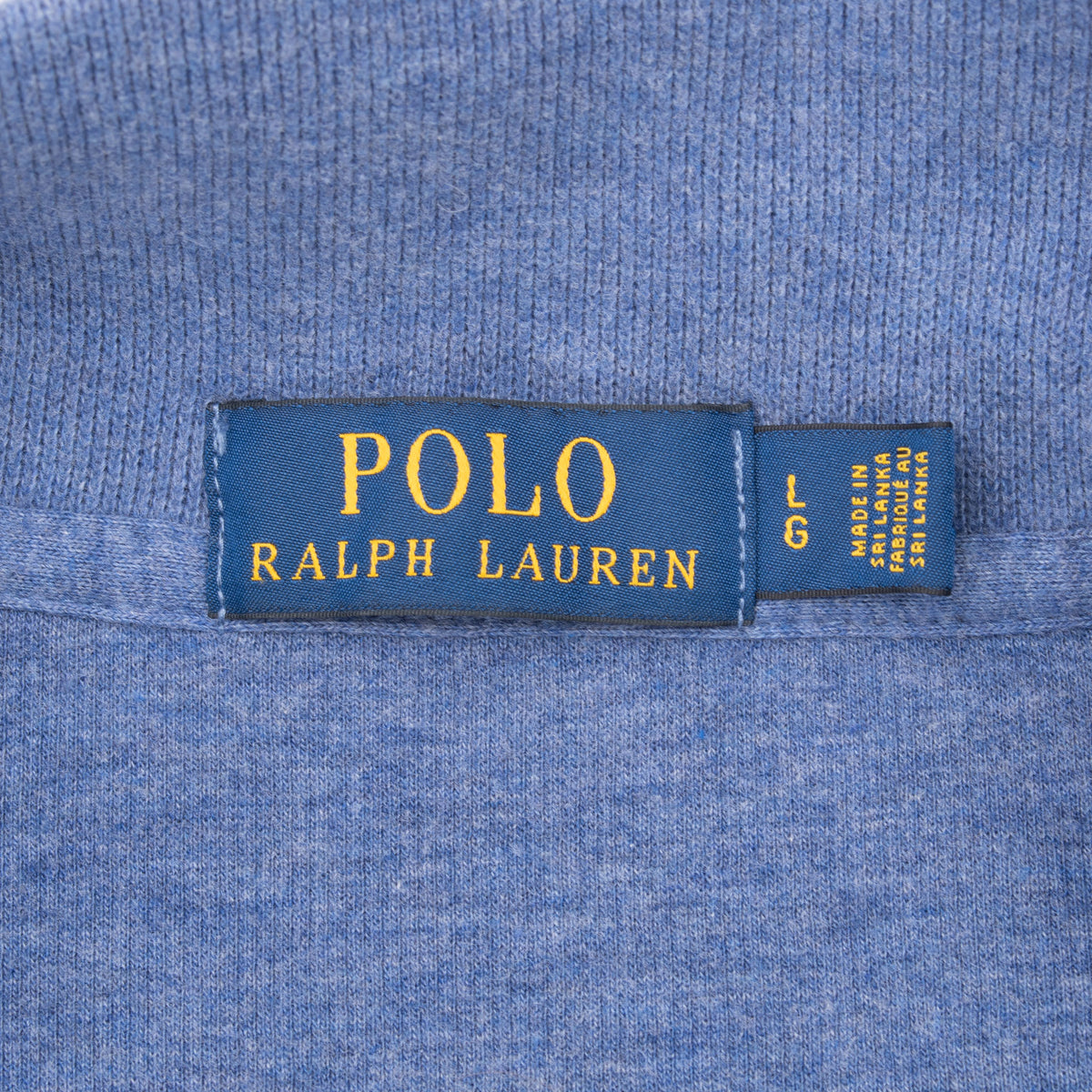 Polo Ralph Lauren neck label with size Large on blue sweater