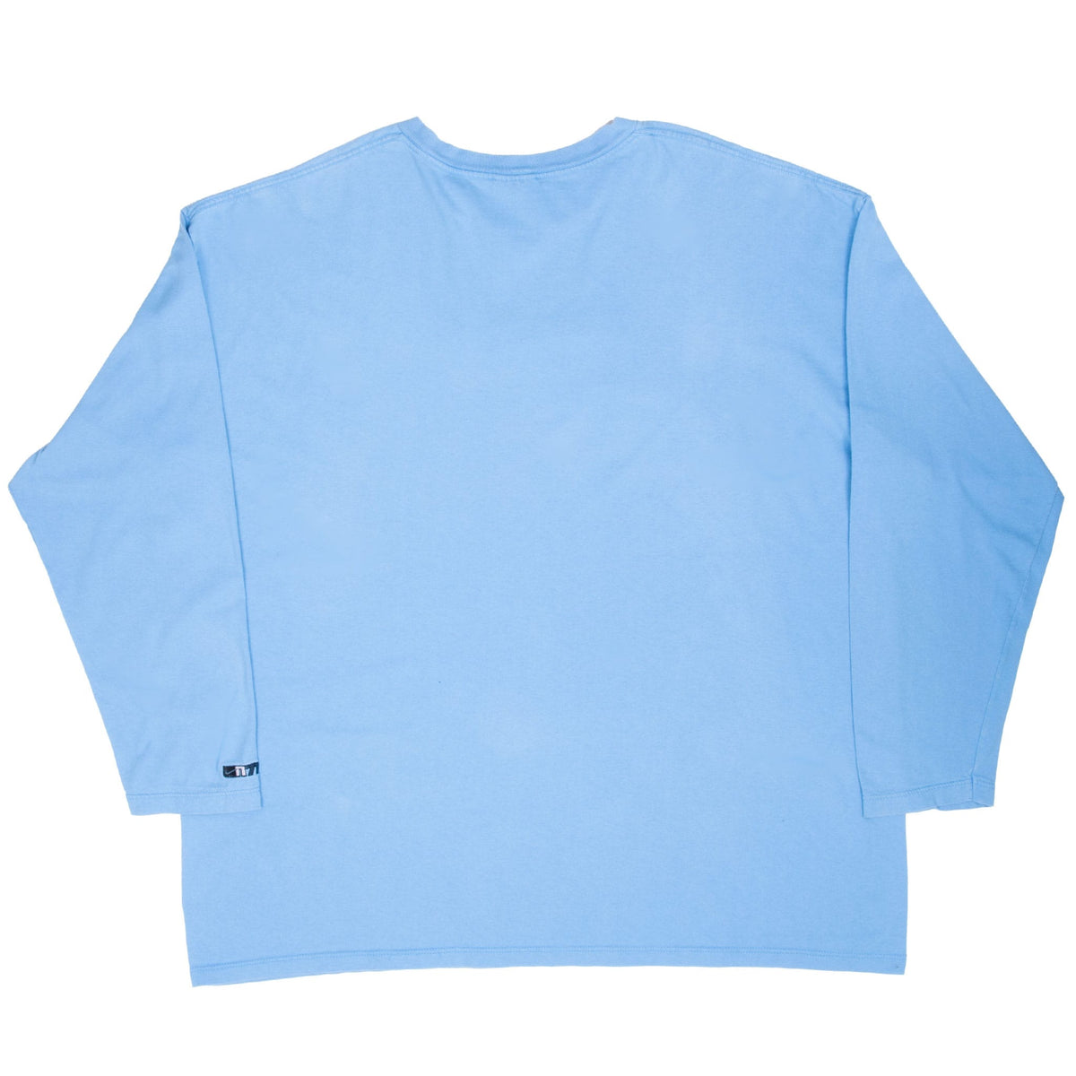 Back of blue Nike long-sleeve T-shirt with small logo detail near sleeve cuff