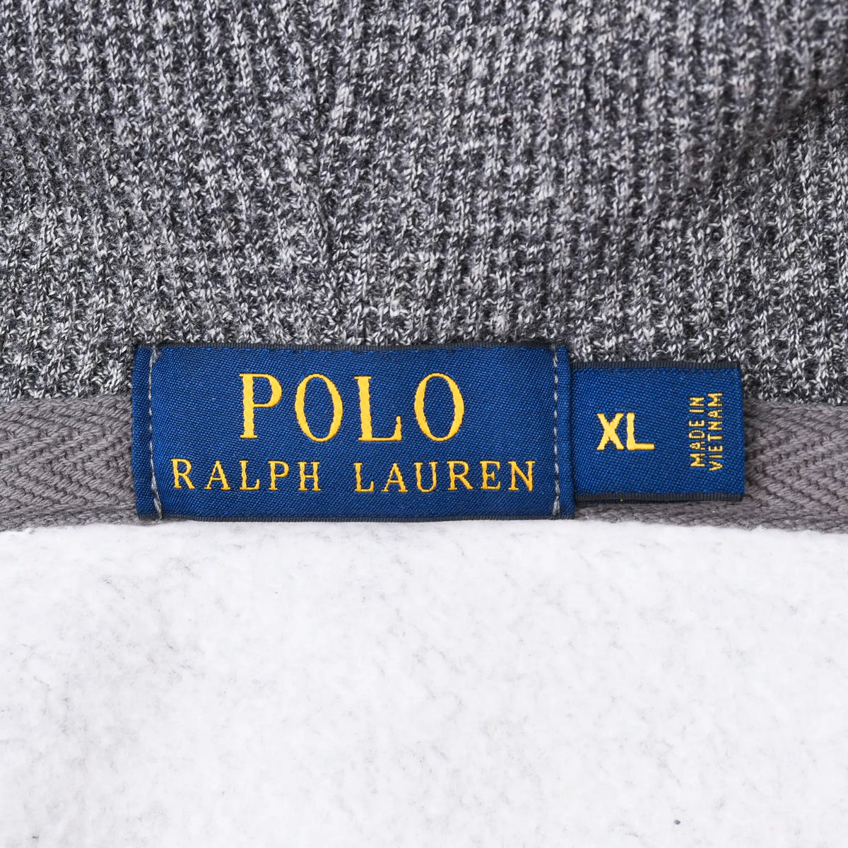 Close-up of blue Polo Ralph Lauren neck label marked XL and made in Vietnam