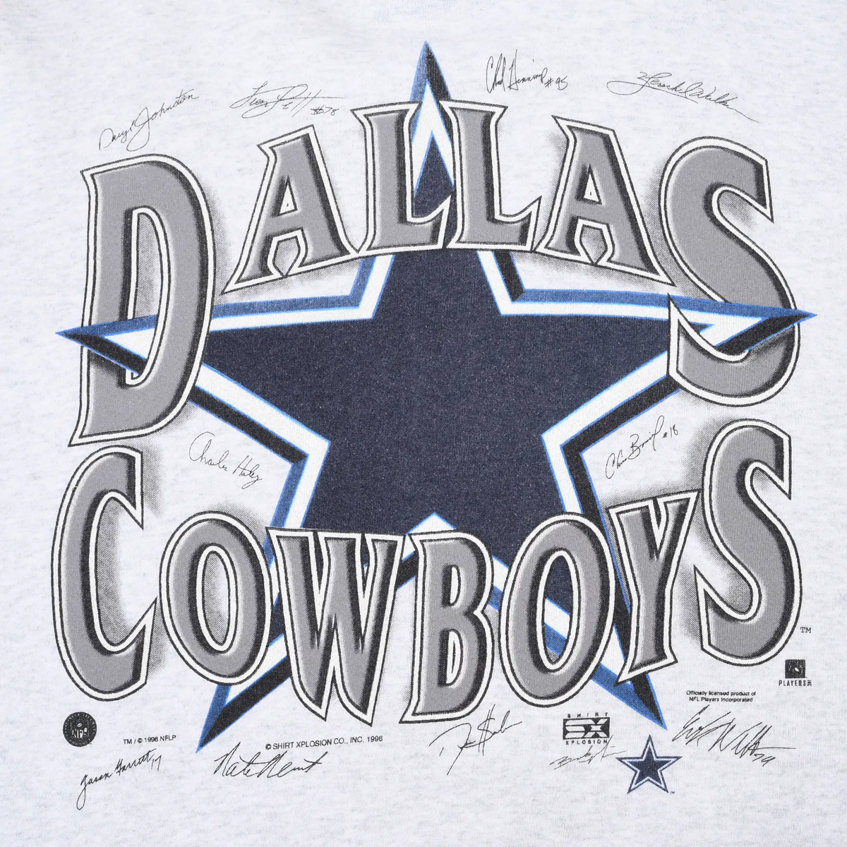 Close-up of Dallas Cowboys front graphic with navy star, outlined lettering, and printed signatures