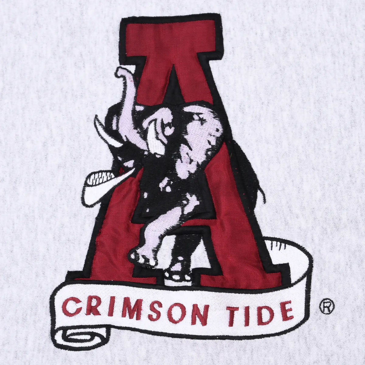 Close-up of embroidered Alabama elephant, crimson A, and Crimson Tide banner