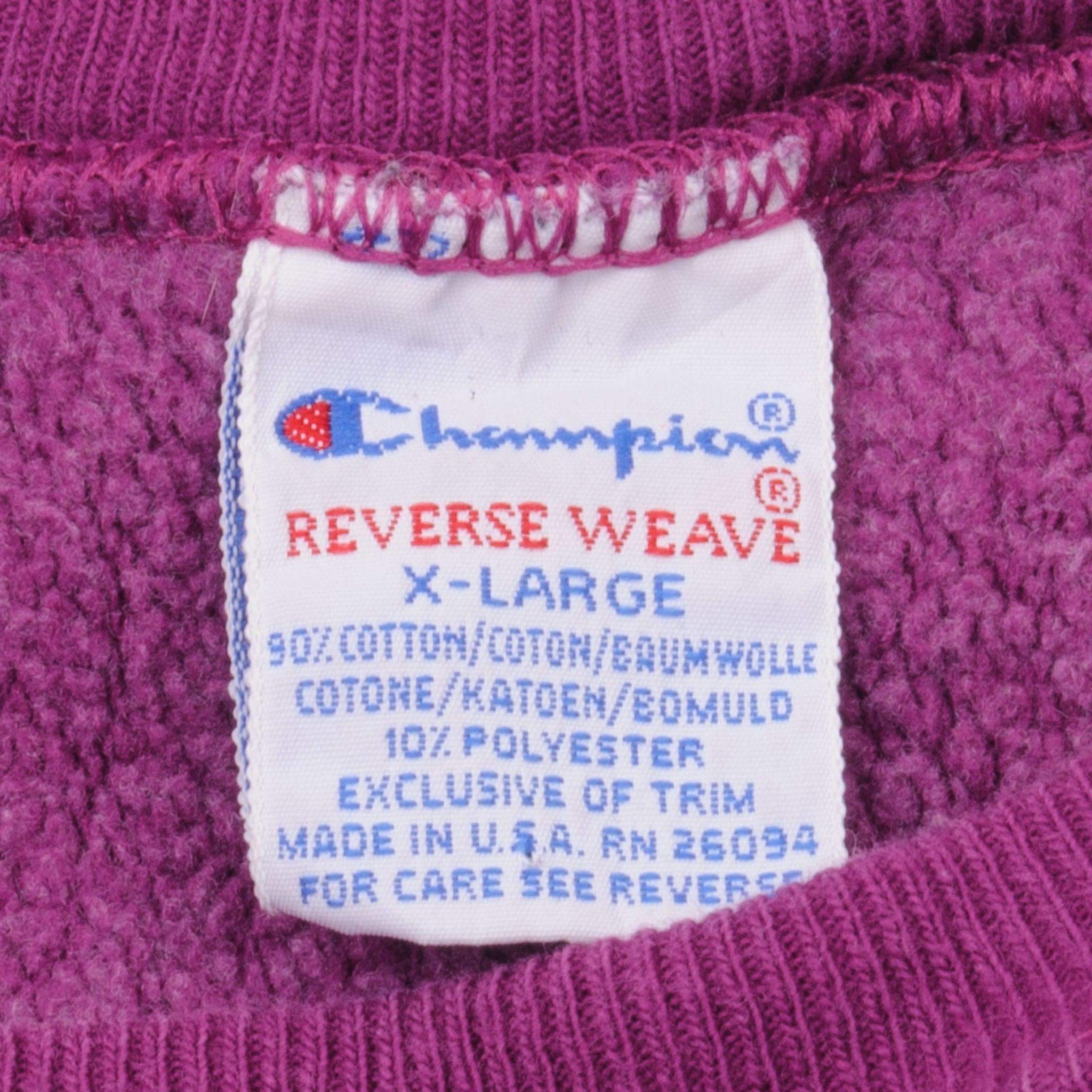 Champion Reverse Weave X-Large Made in USA neck label on fuchsia sweatshirt