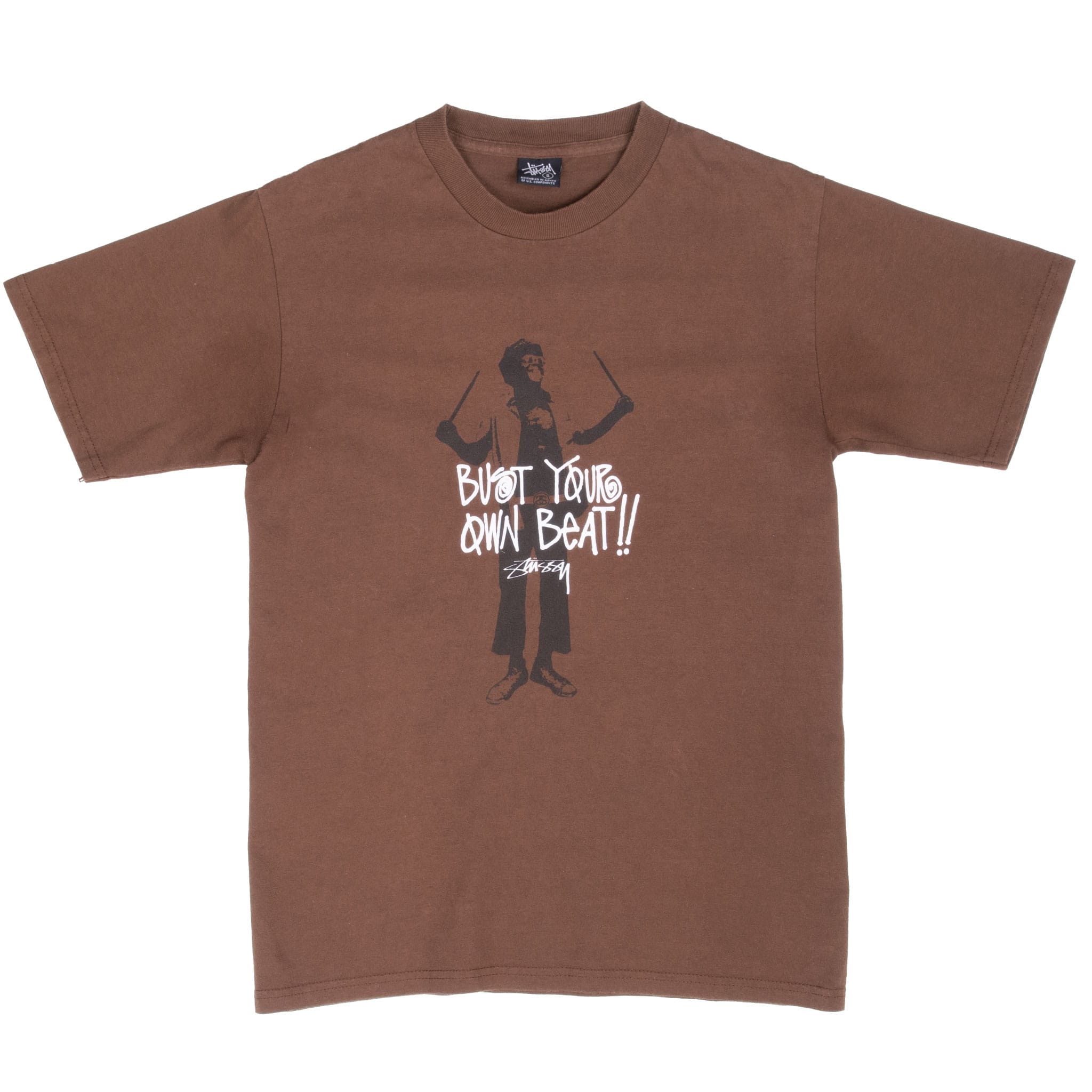 Full front of brown Stussy crewneck T-shirt with centered Bust Your Own Beat drummer graphic