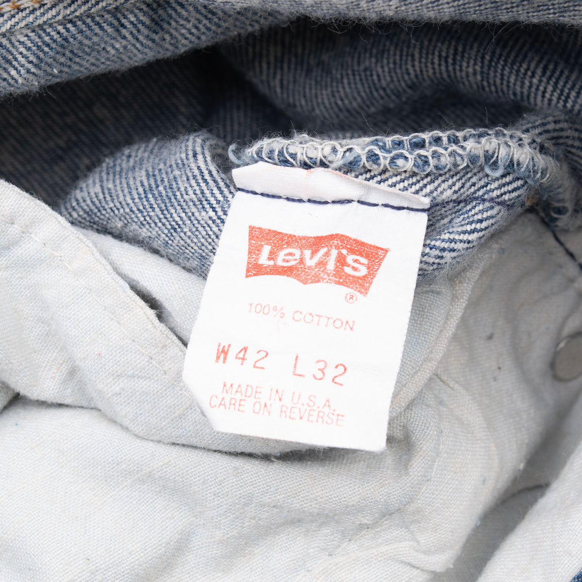 Levi's interior size and care tag marked W42 L32 and Made in U.S.A.