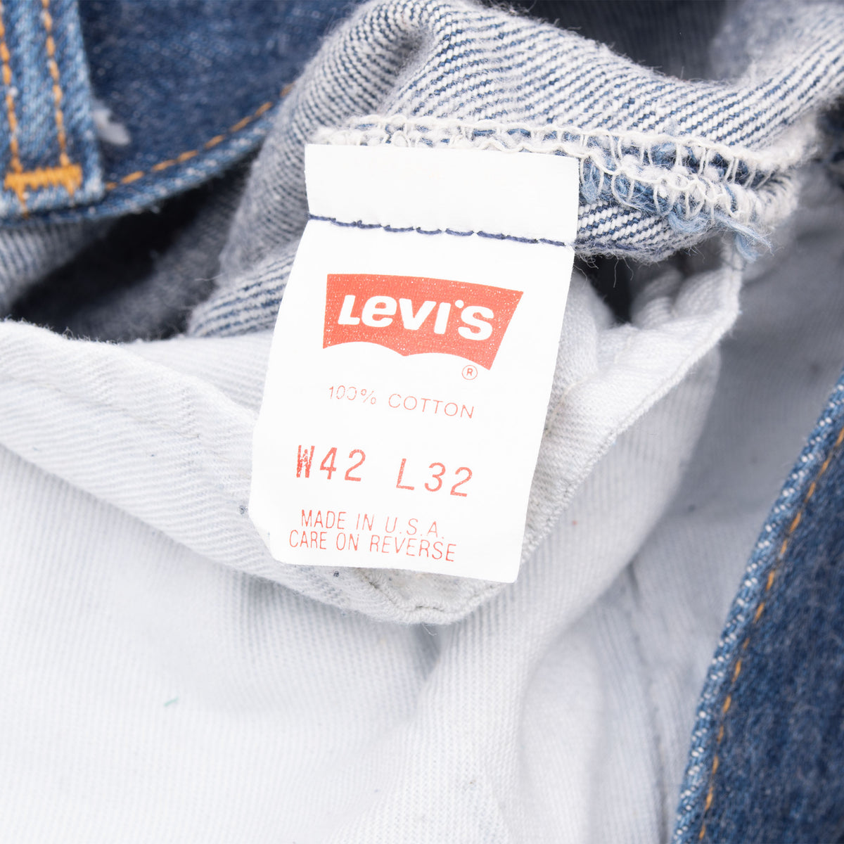 Levi's interior tag marked W42 L32, 100% cotton and Made in USA