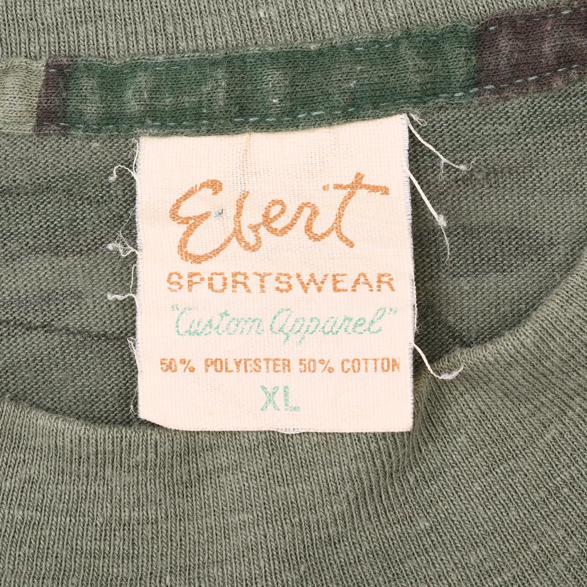 Ebert Sportswear neck label with Auto Apparel branding and 50% polyester, 50% cotton text