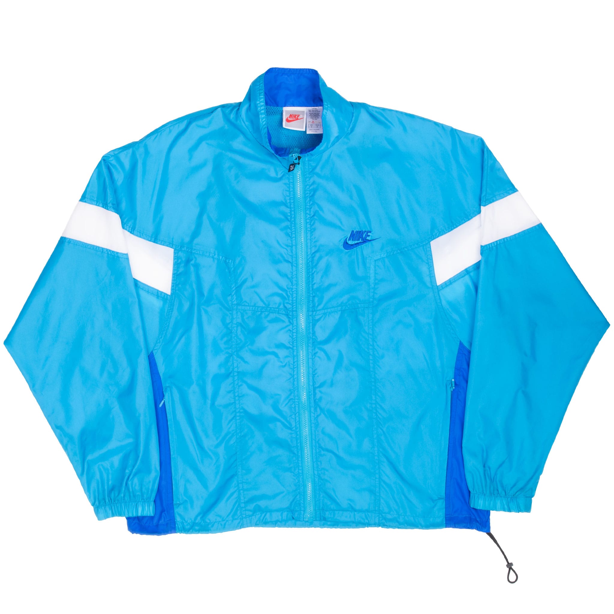 Full front view of blue Nike windbreaker with zip pockets, elastic cuffs and drawcord hem