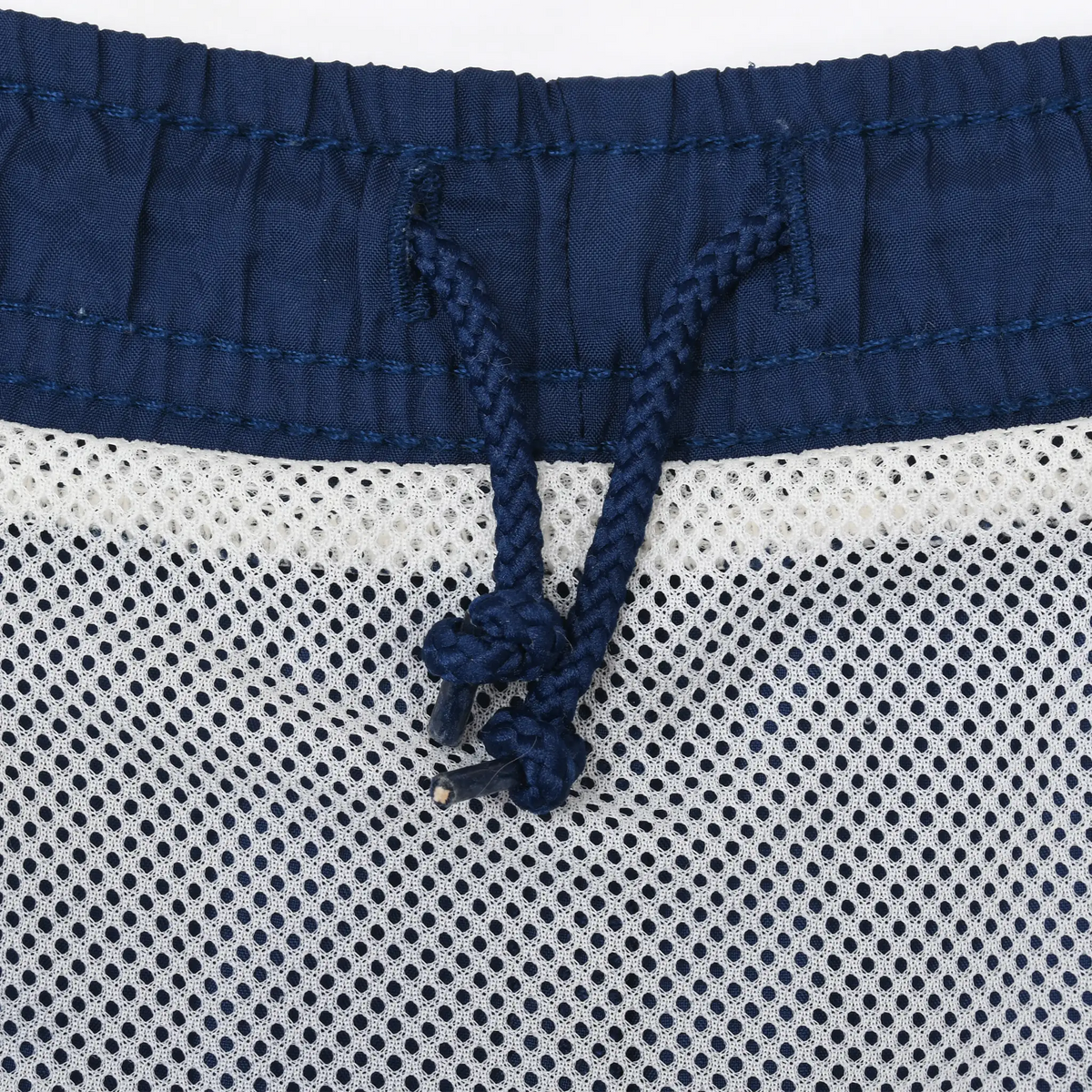 Interior waistband detail with navy drawstring and white mesh lining