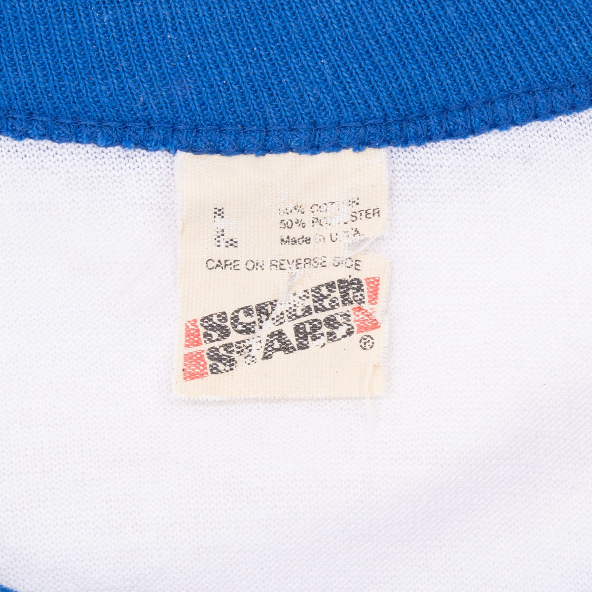 Sportswear T-shirt neck tag beneath blue ribbed collar
