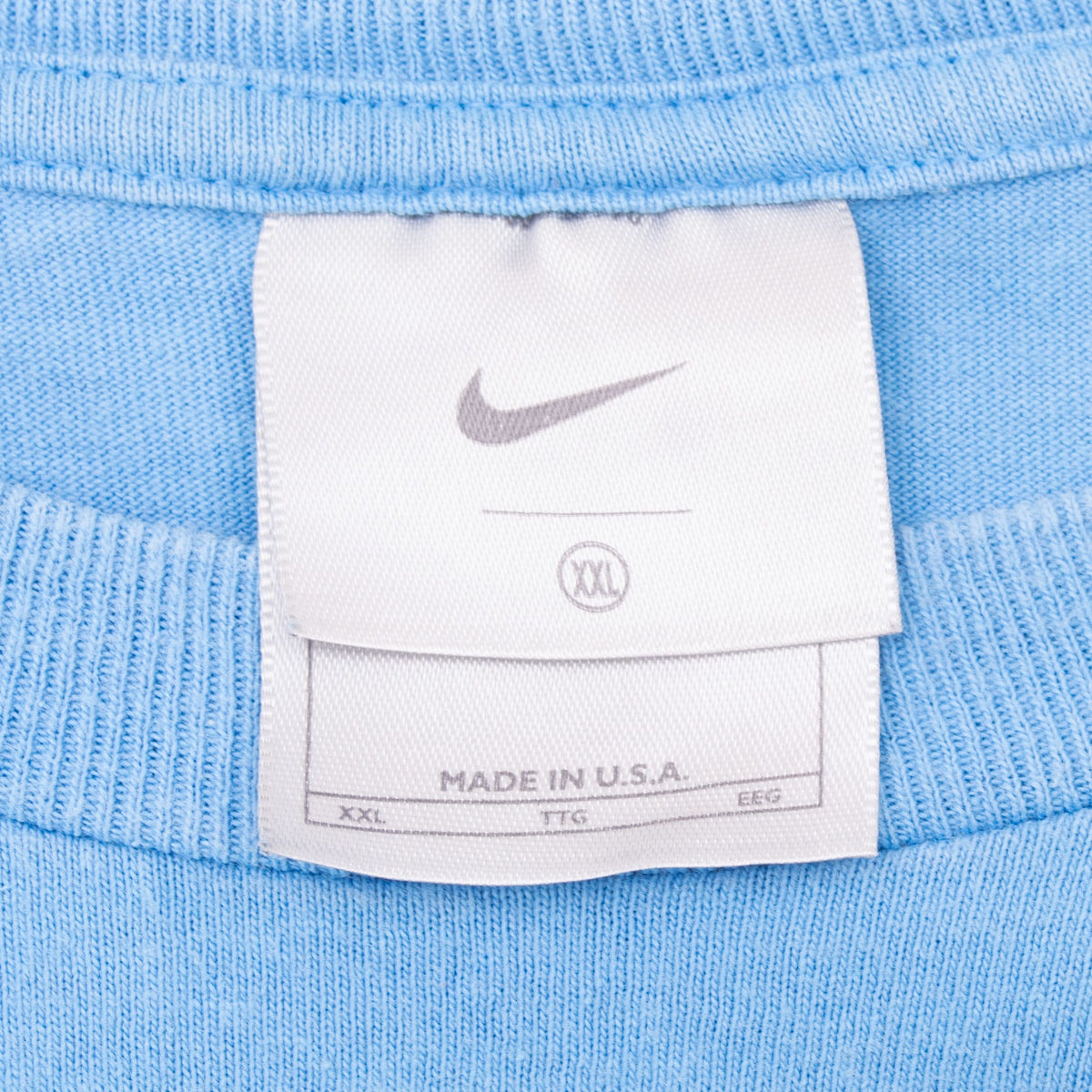 Nike neck tag showing Swoosh, size XXL and Made in U.S.A. text