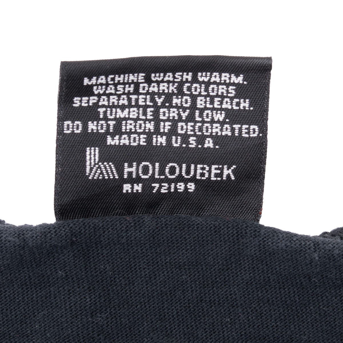 Holoubek care label with washing instructions and Made in U.S.A. text