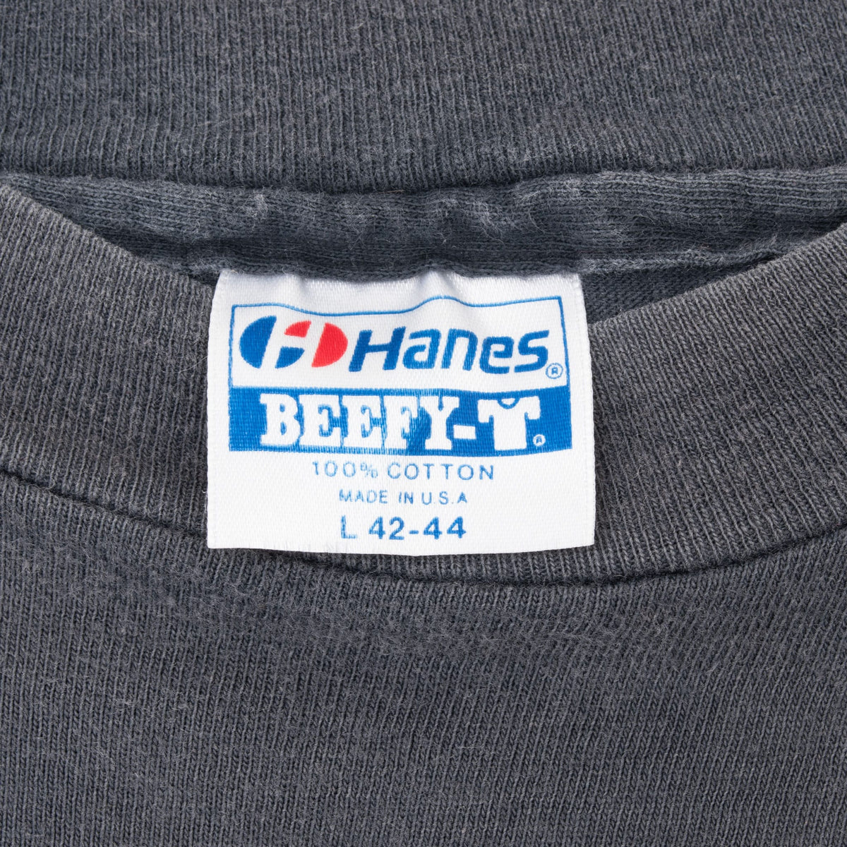 Hanes Beefy-T neck label marked 100% cotton, made in USA and L 42-44