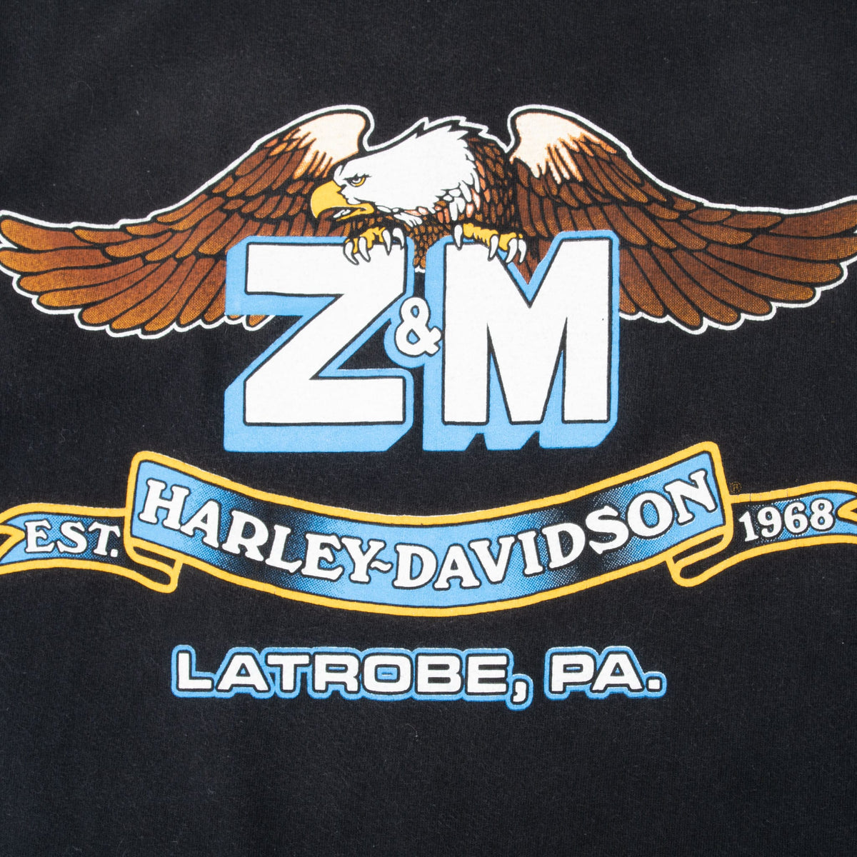 Back print detail with winged eagle, Z&M Harley-Davidson, Est. 1968 and Latrobe, PA