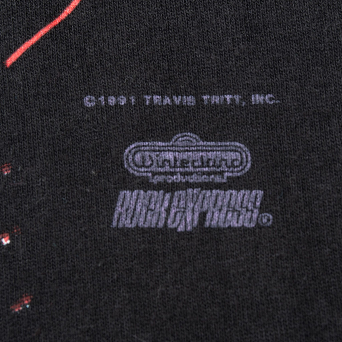 Close-up of Travis Tritt copyright and Brockum merchandising print
