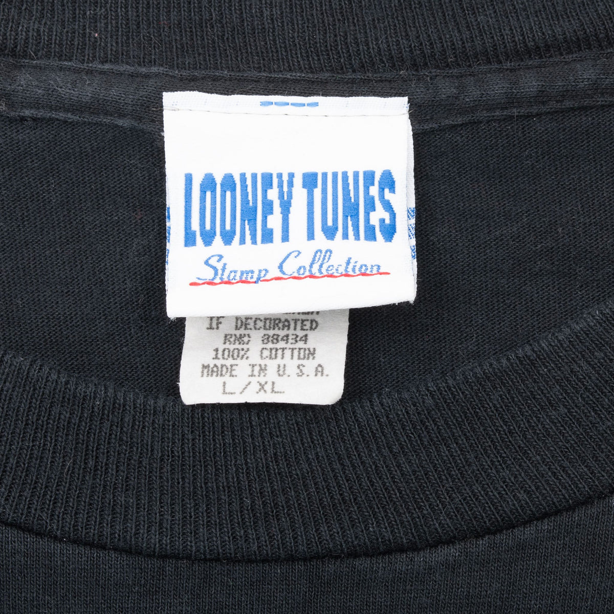 Looney Tunes Stamp Collection neck tag with cotton, Made in USA, and L/XL text
