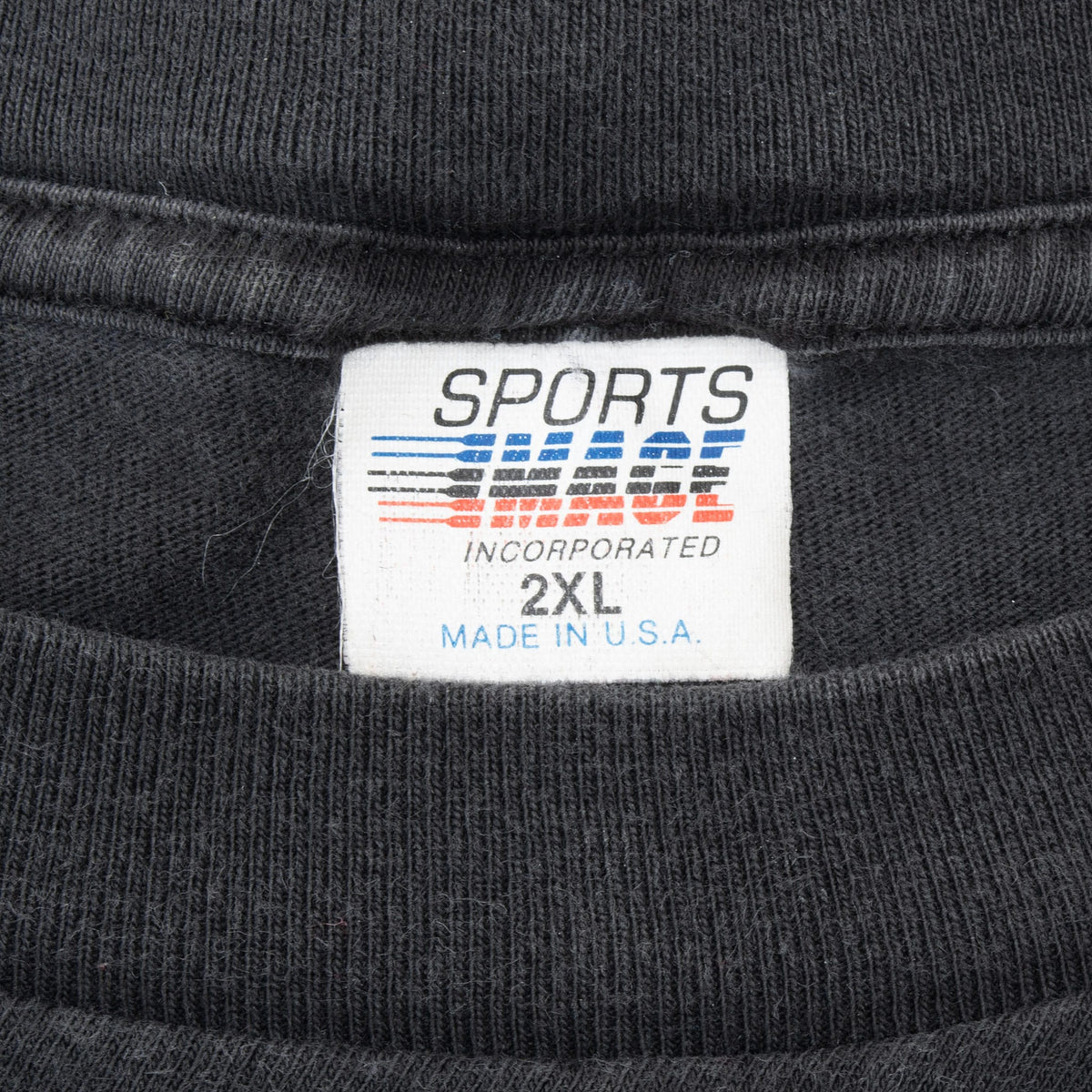 Sports Incorporated neck tag marked 2XL and Made in U.S.A. on black T-shirt