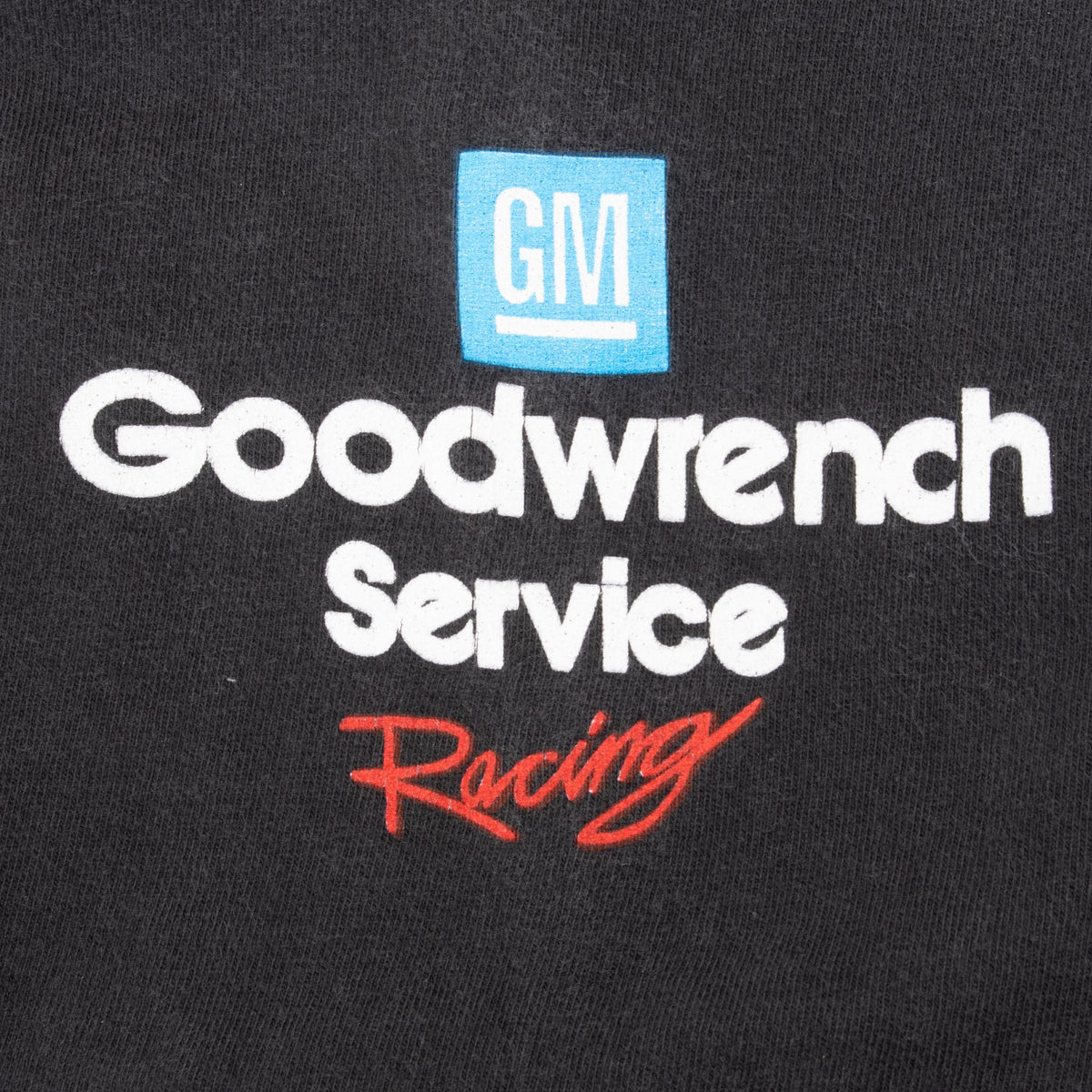Close-up of GM Goodwrench Service Racing sleeve print in blue, white, and red