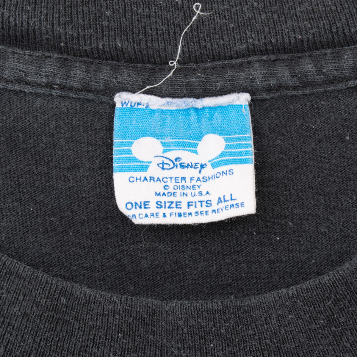 Disney Character Fashions neck tag reading one size fits all and made in USA