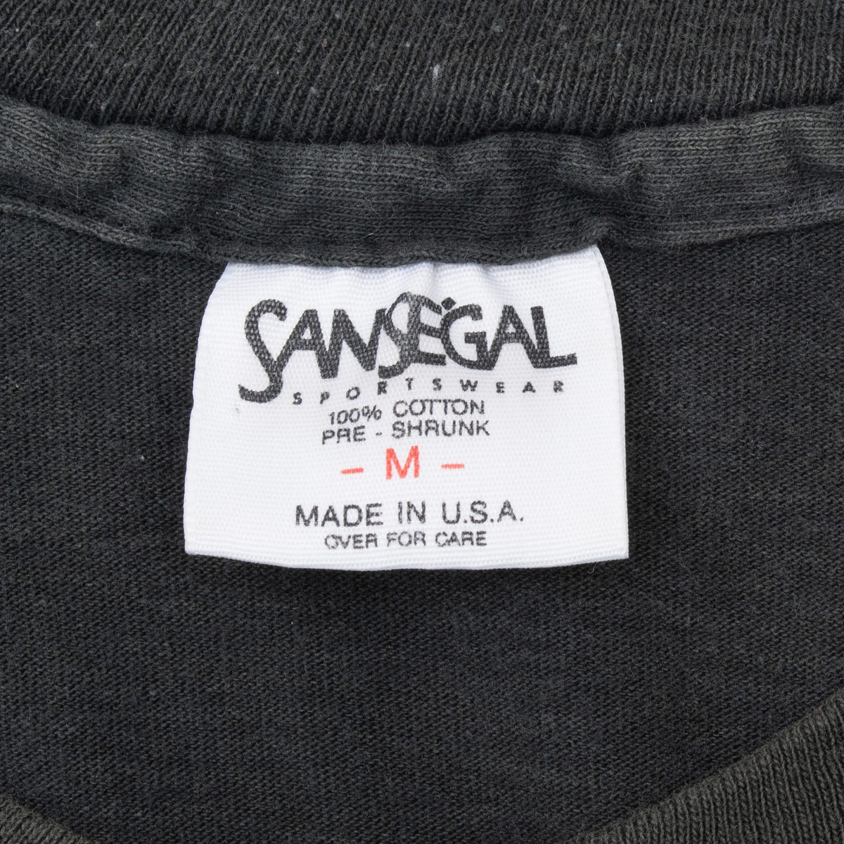 San Segal Sportswear neck tag marked medium, 100% cotton, pre-shrunk and made in USA
