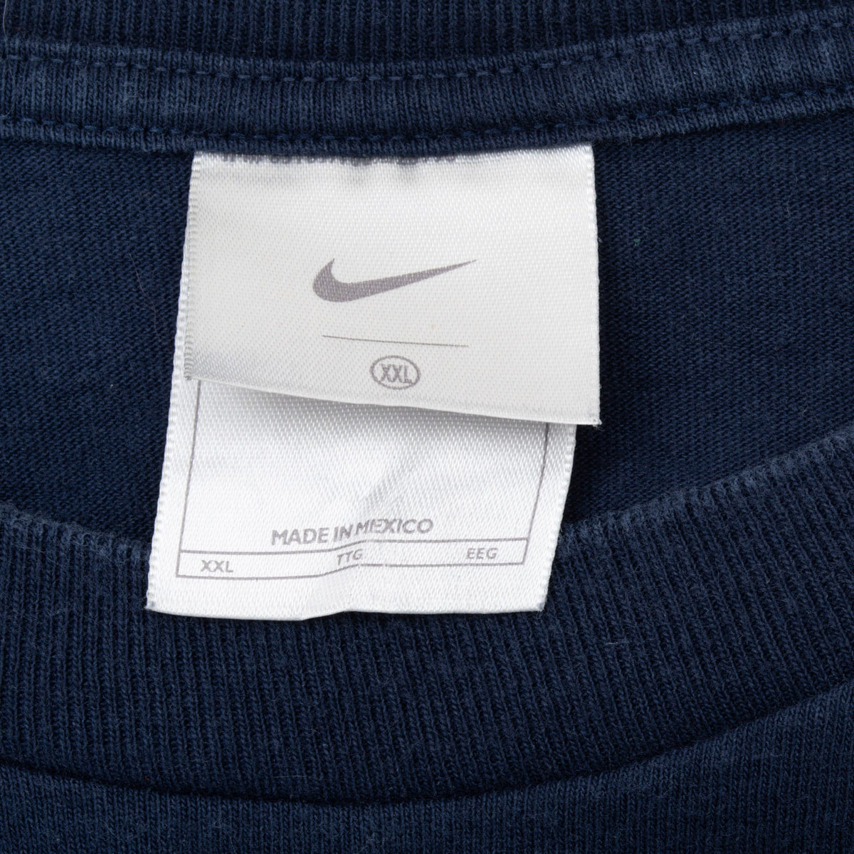 Nike Swoosh neck tag marked XXL inside navy ribbed crew neckline