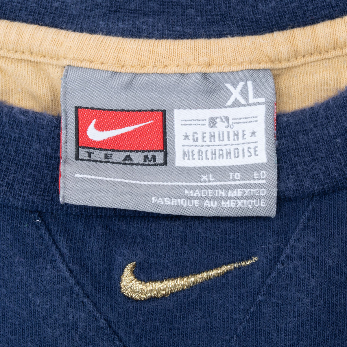 Nike Team XL merchandise neck label and embroidered gold Swoosh on blue Brewers T-shirt