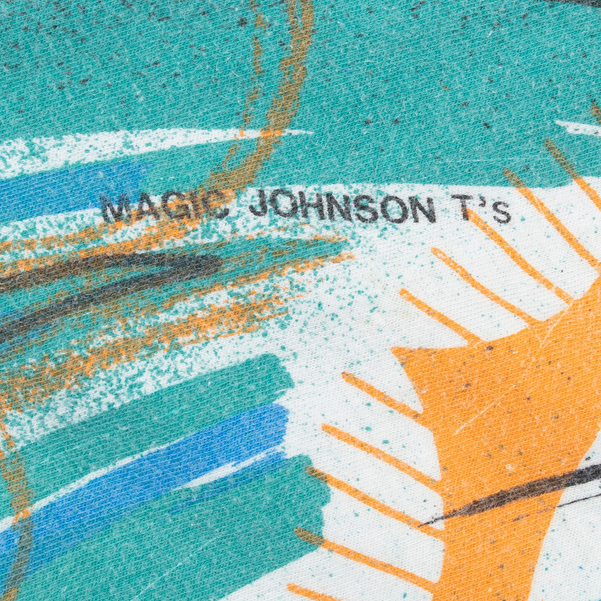 Magic Johnson T's signature printed within the aqua and orange shirt graphic