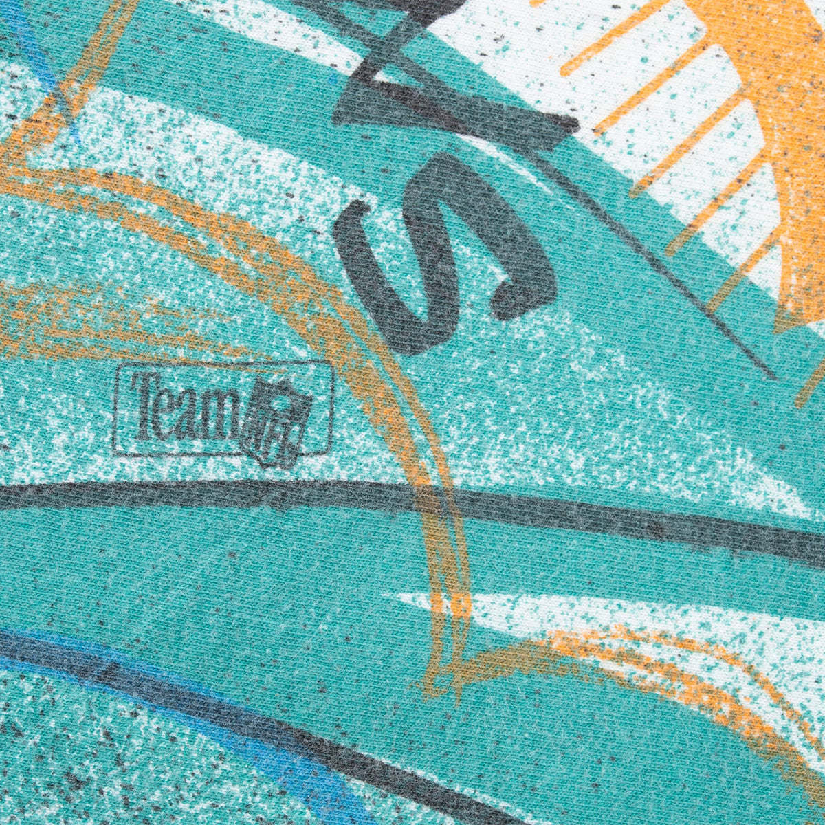 Team NFL mark printed within the aqua Miami Dolphins all-over graphic