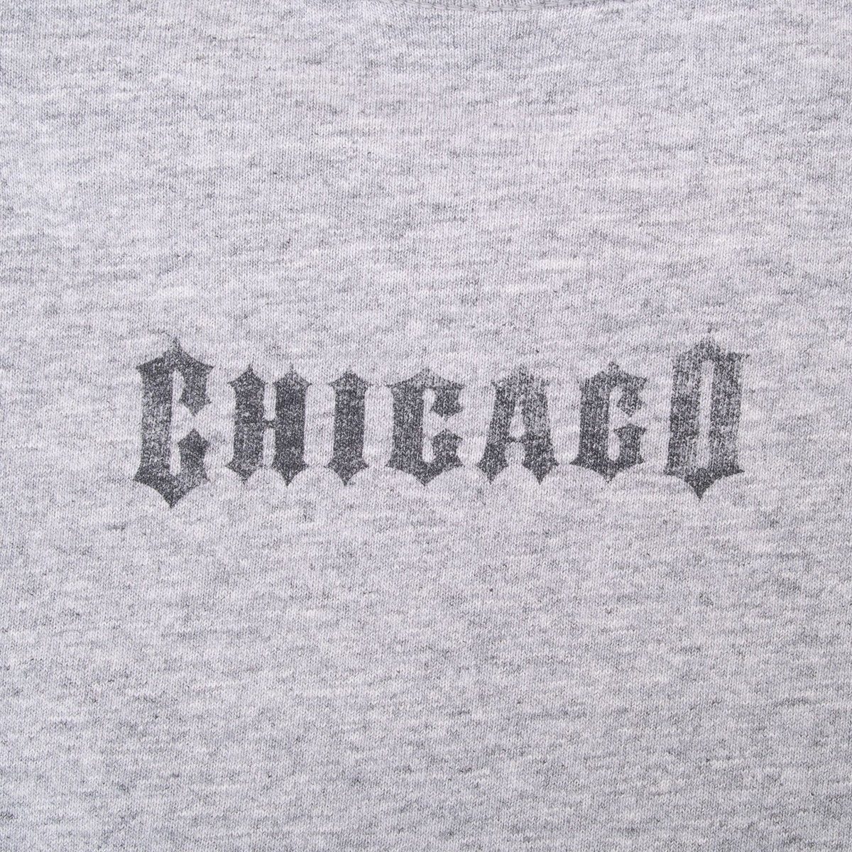 Close-up of small Gothic-style Chicago print on upper back