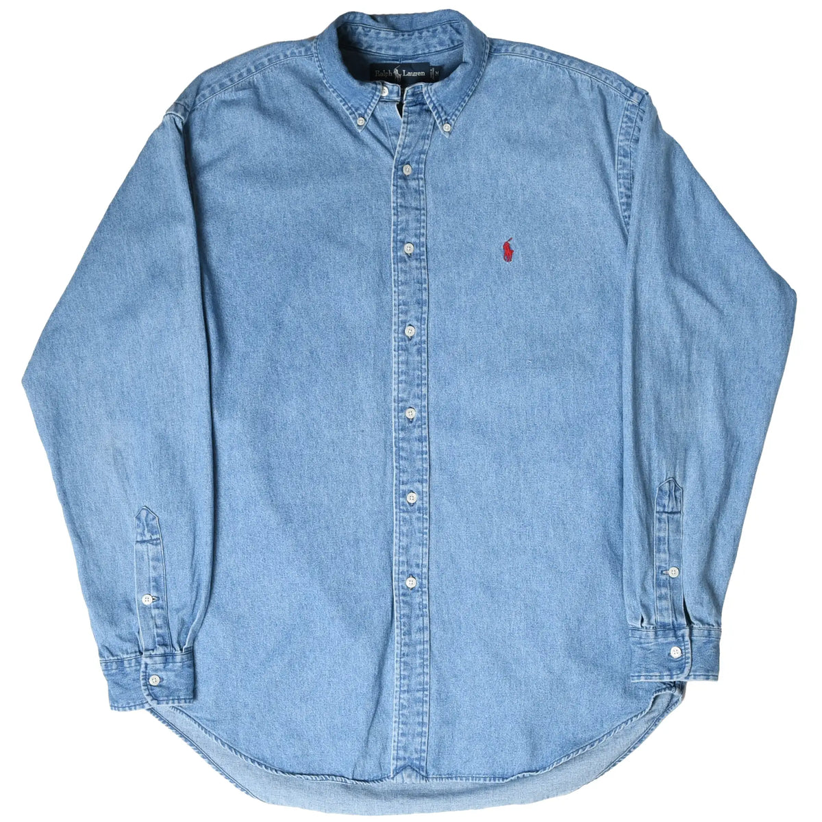 Full front view of Polo Ralph Lauren blue denim shirt with button-down collar and curved hem