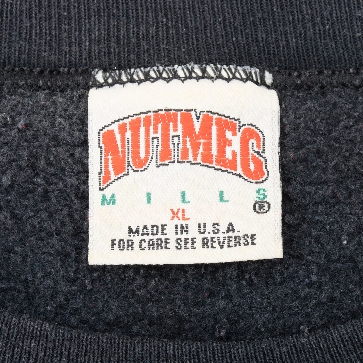 Nutmeg Mills neck label marked XL, Made in U.S.A. and For Care See Reverse