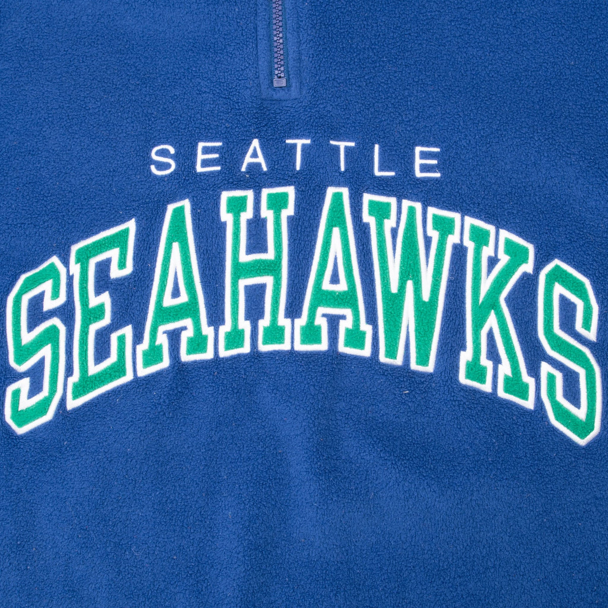 Close-up of arched Seattle Seahawks chest lettering in green and white