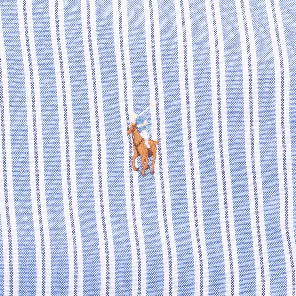 Multicolor Polo pony chest embroidery on blue and white striped fabric