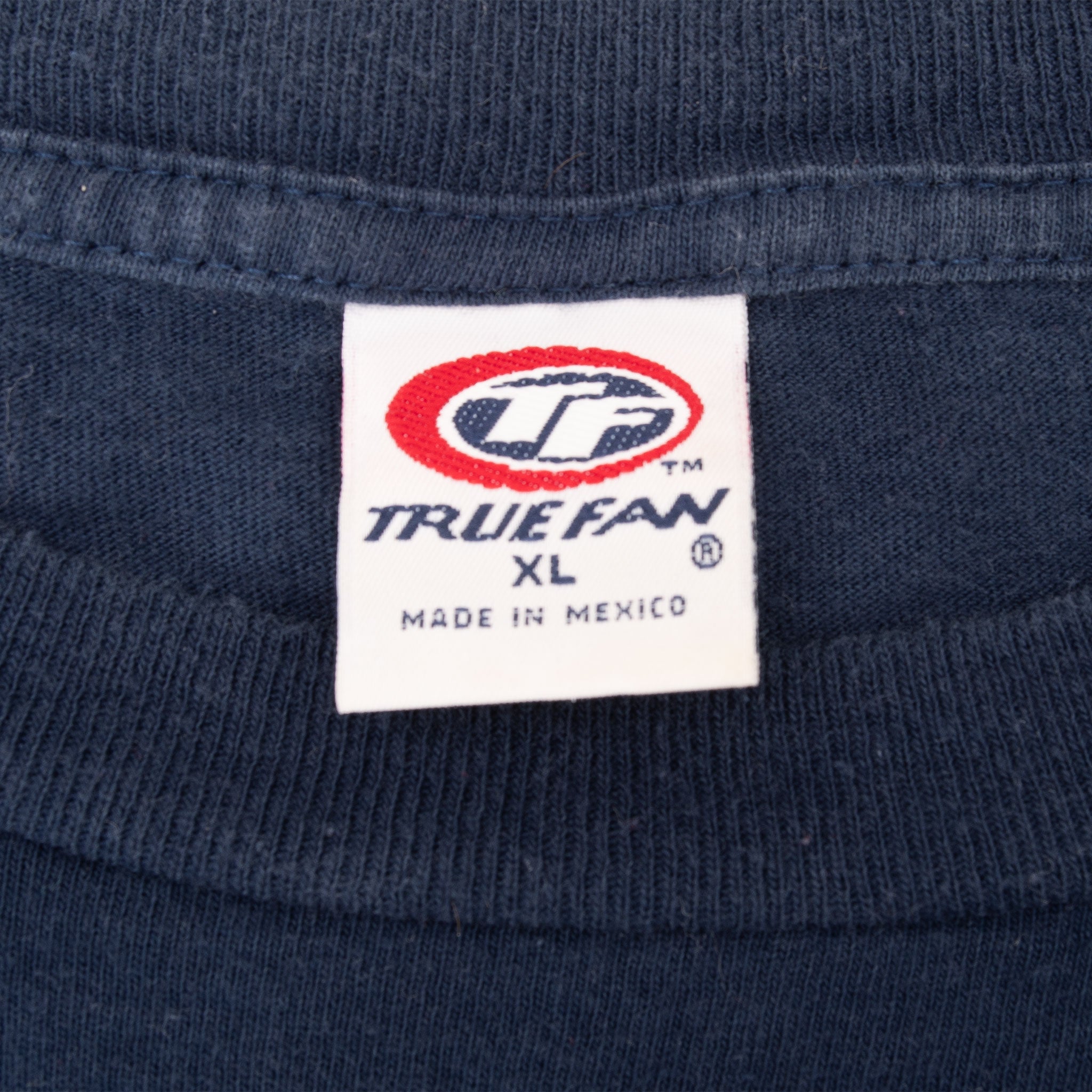 True Fan XL neck tag on navy T-shirt