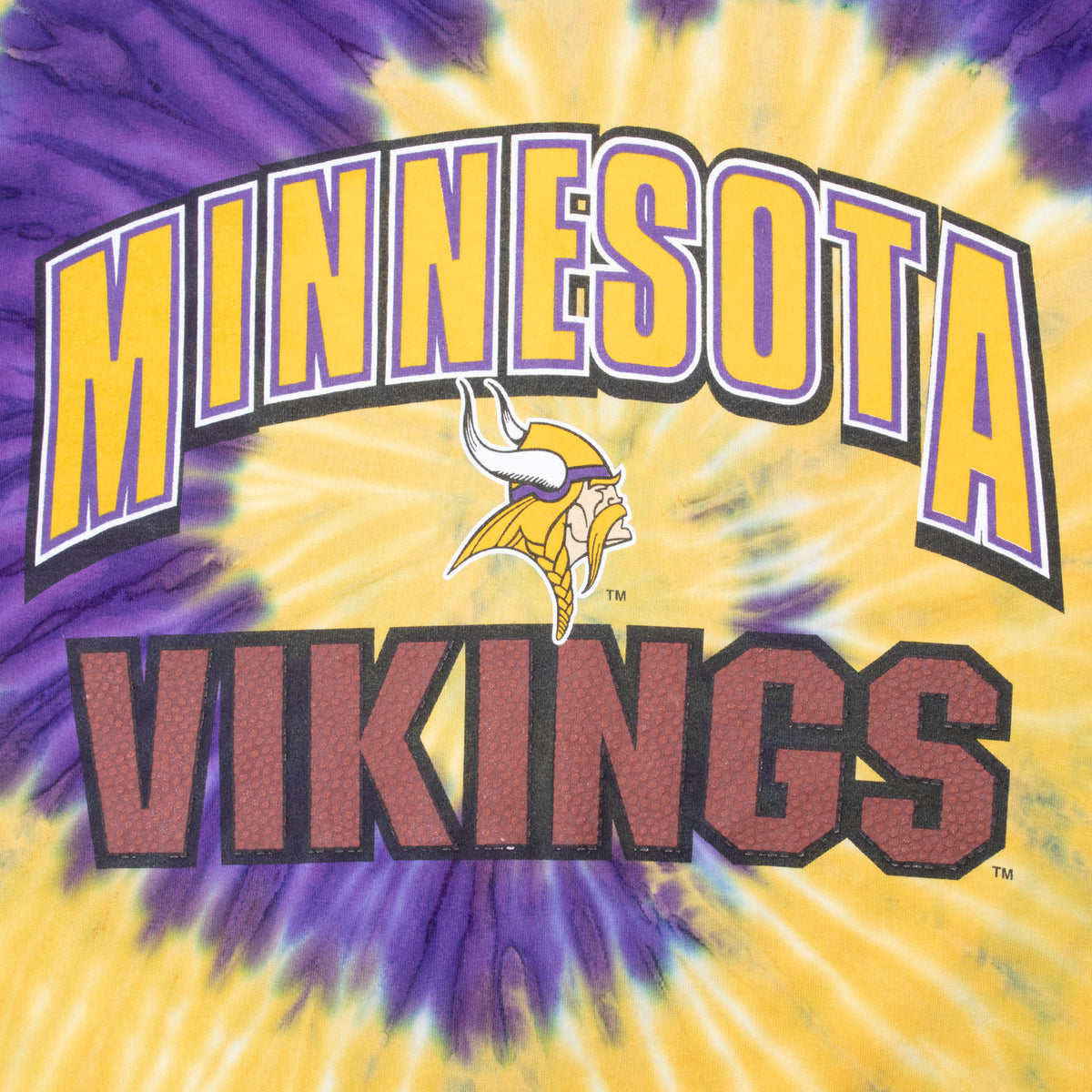 Close-up of Minnesota Vikings wordmark and Viking head graphic on purple and yellow tie-dye