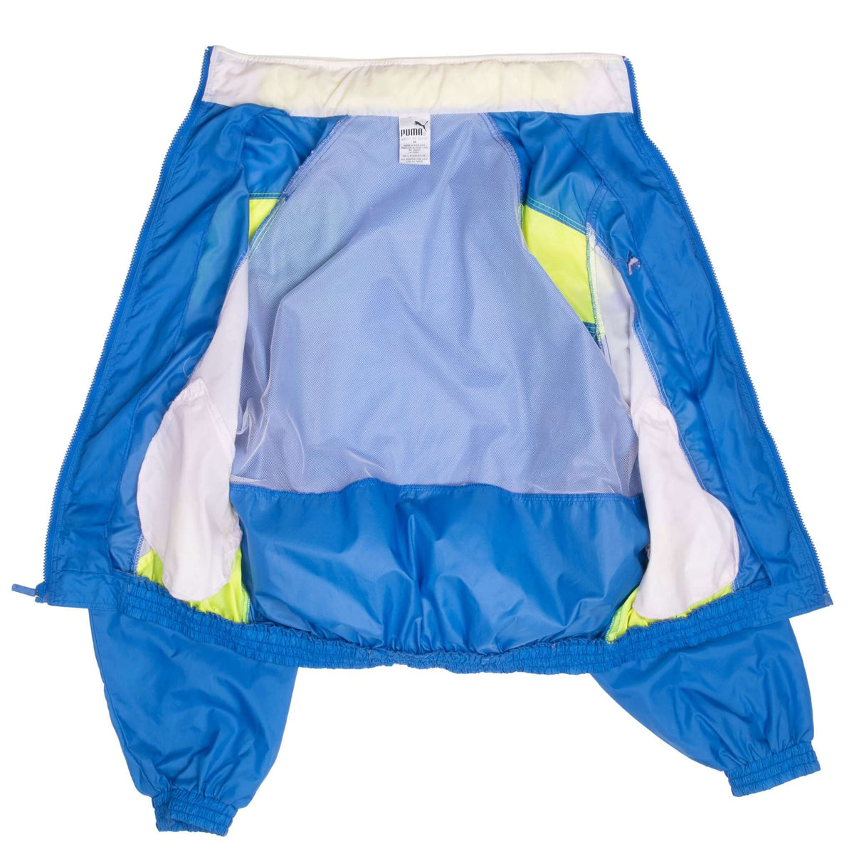 Open Puma windbreaker showing blue mesh lining and color-block interior
