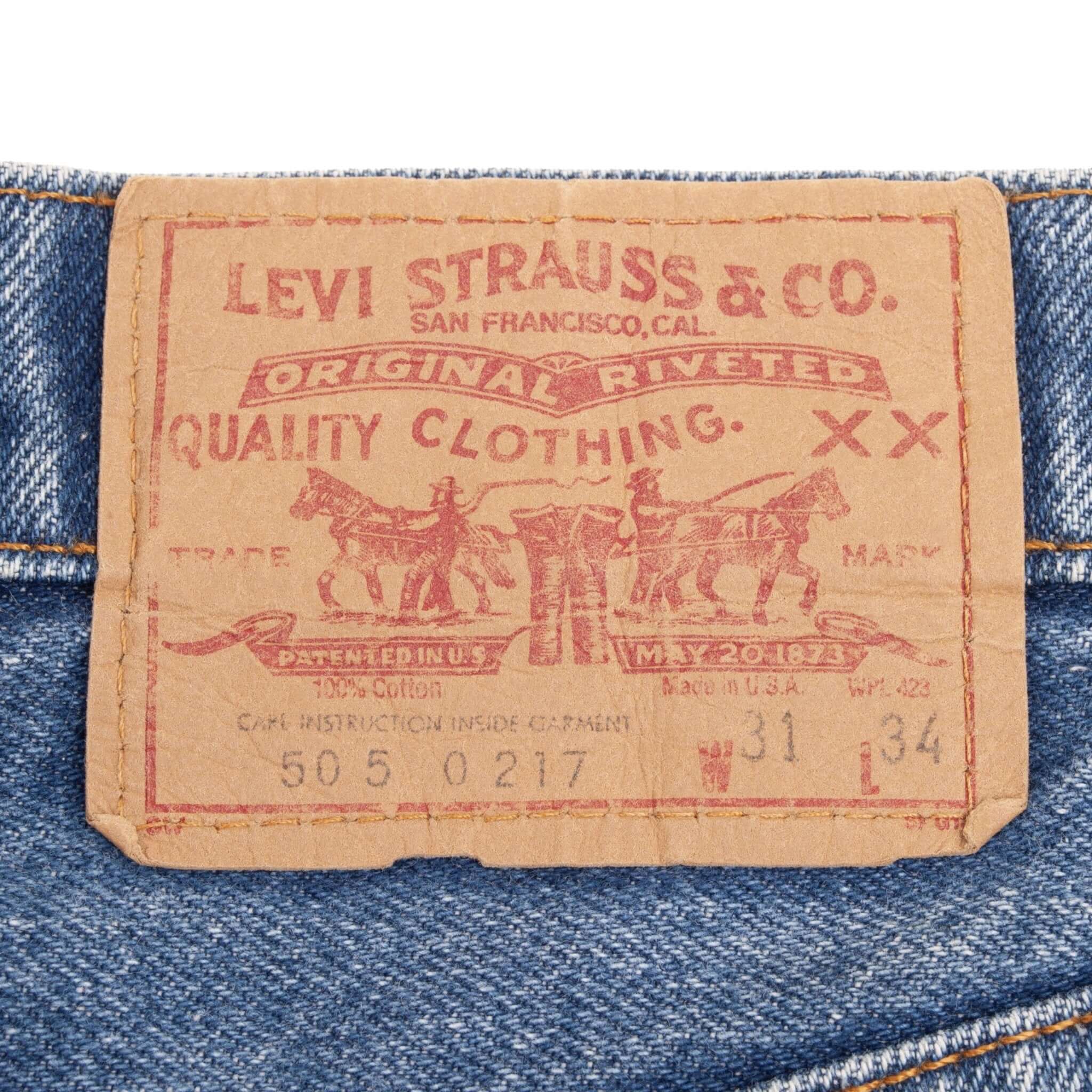 Beautiful Indigo Levis 505 Jeans Made in USA with a medium light blue wash.  Size on Tag 31X34  Back Button #650