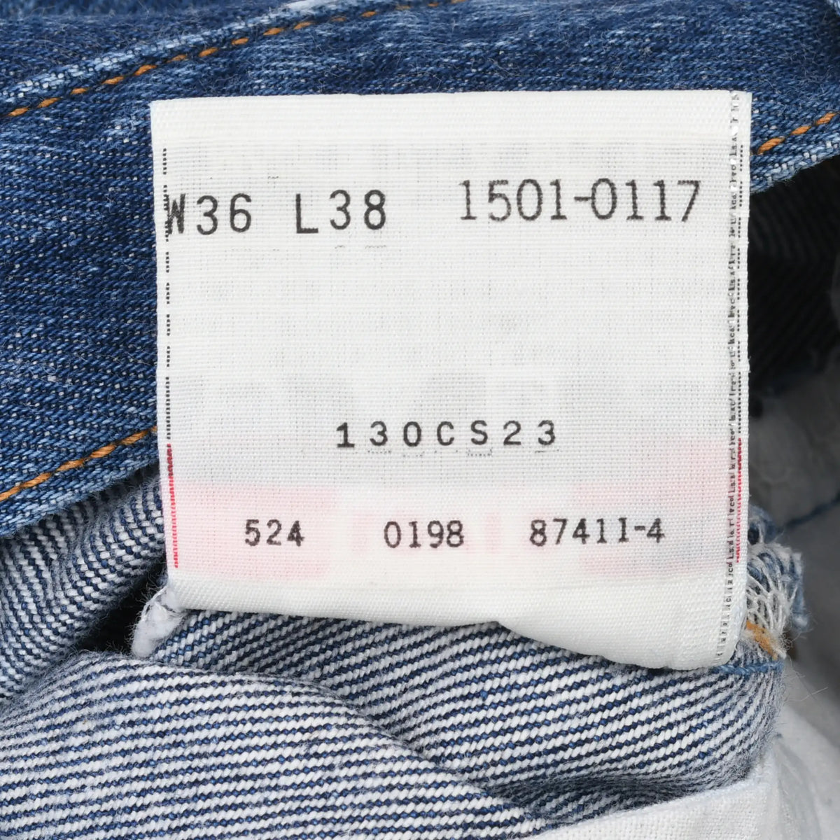 Close-up of Levi's inner label marked W36 L38, 1501-0117, and 524