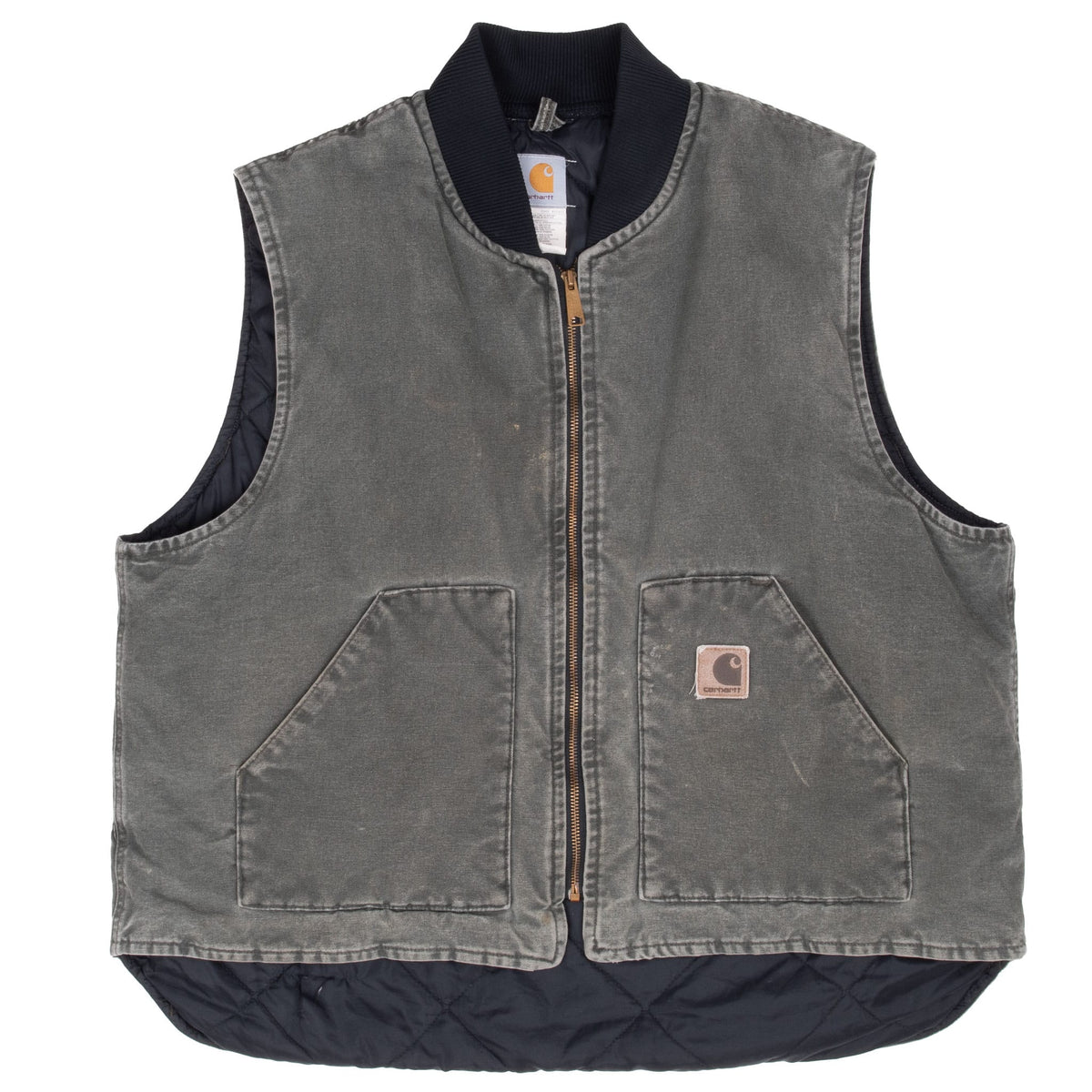 Full front of faded green Carhartt vest showing patch pockets and extended black quilted lining