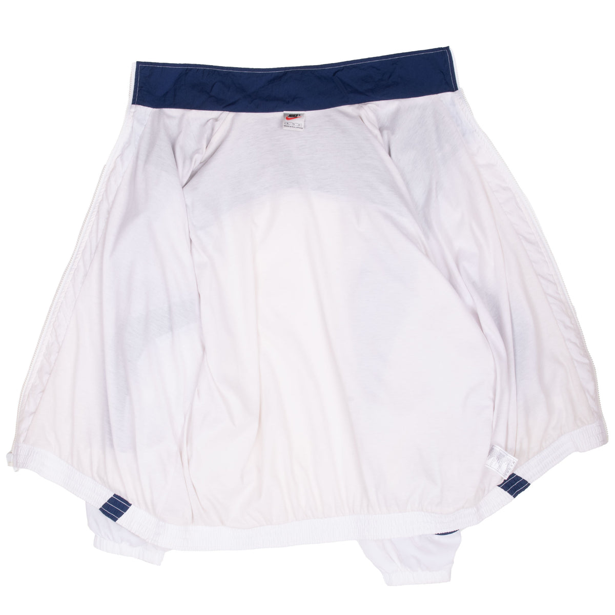 Interior view of white Nike windbreaker with navy collar lining