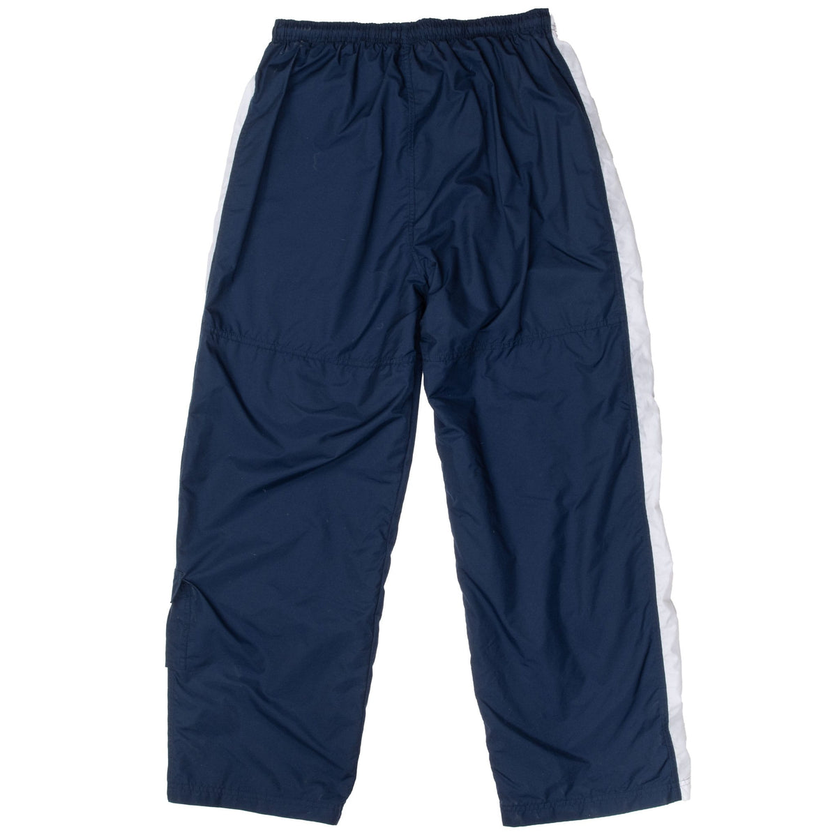 Back of blue Nike track pants with white side panels and seamed knees