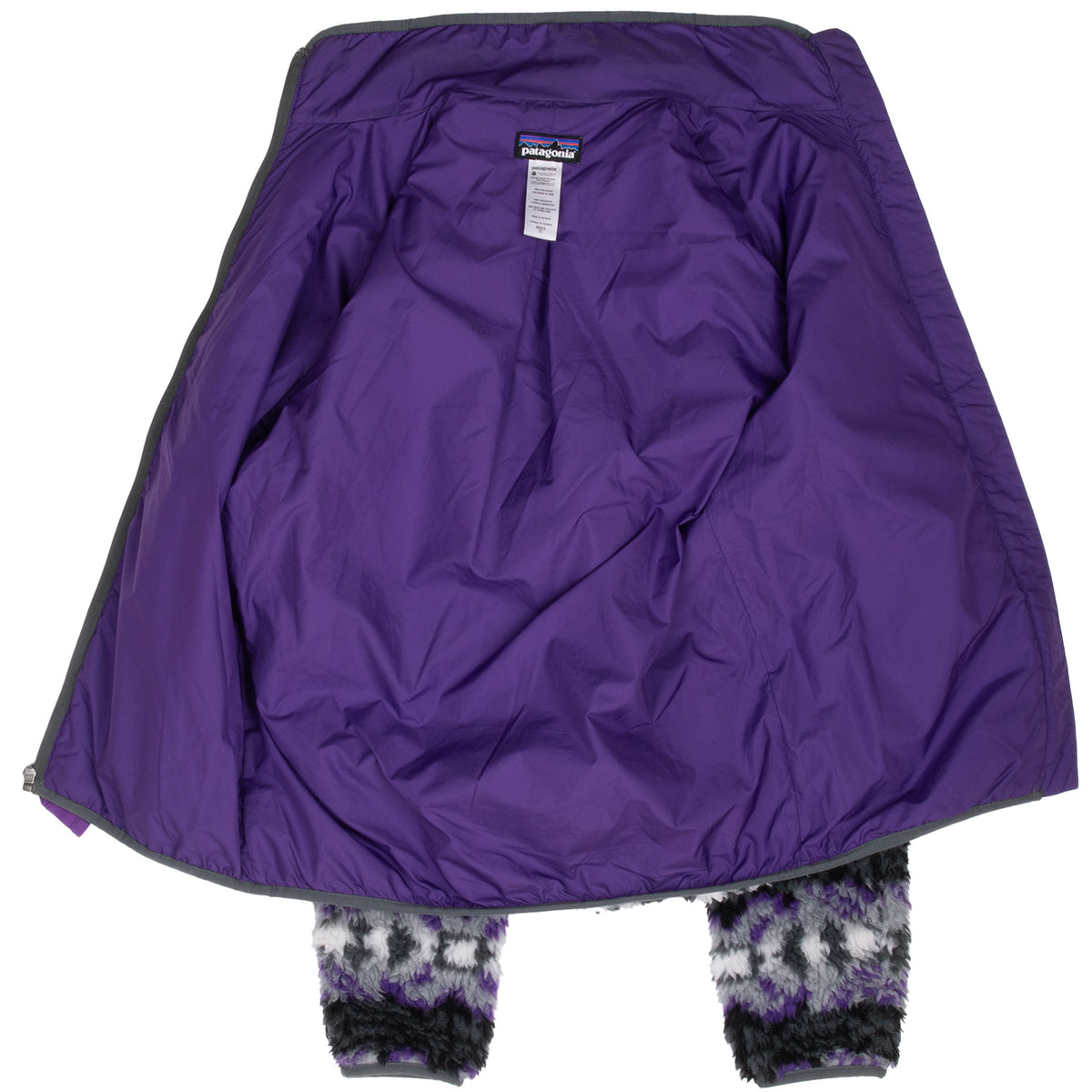 Open Patagonia Retro-X jacket showing purple interior lining and neck labels
