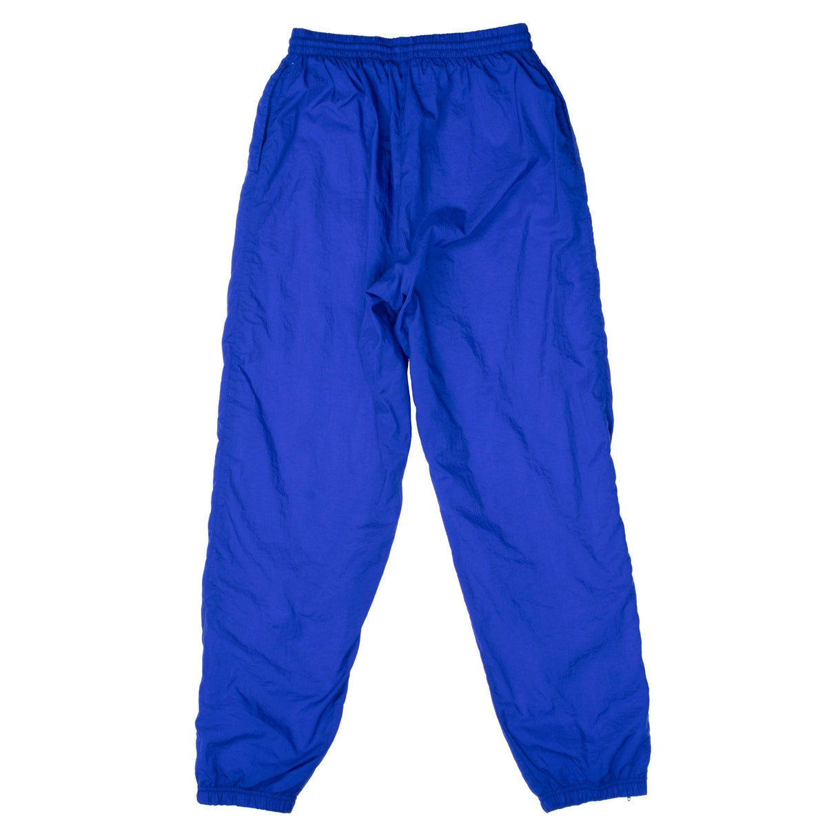 Back of blue-purple Nike women's track pants with elastic waistband and cuffs