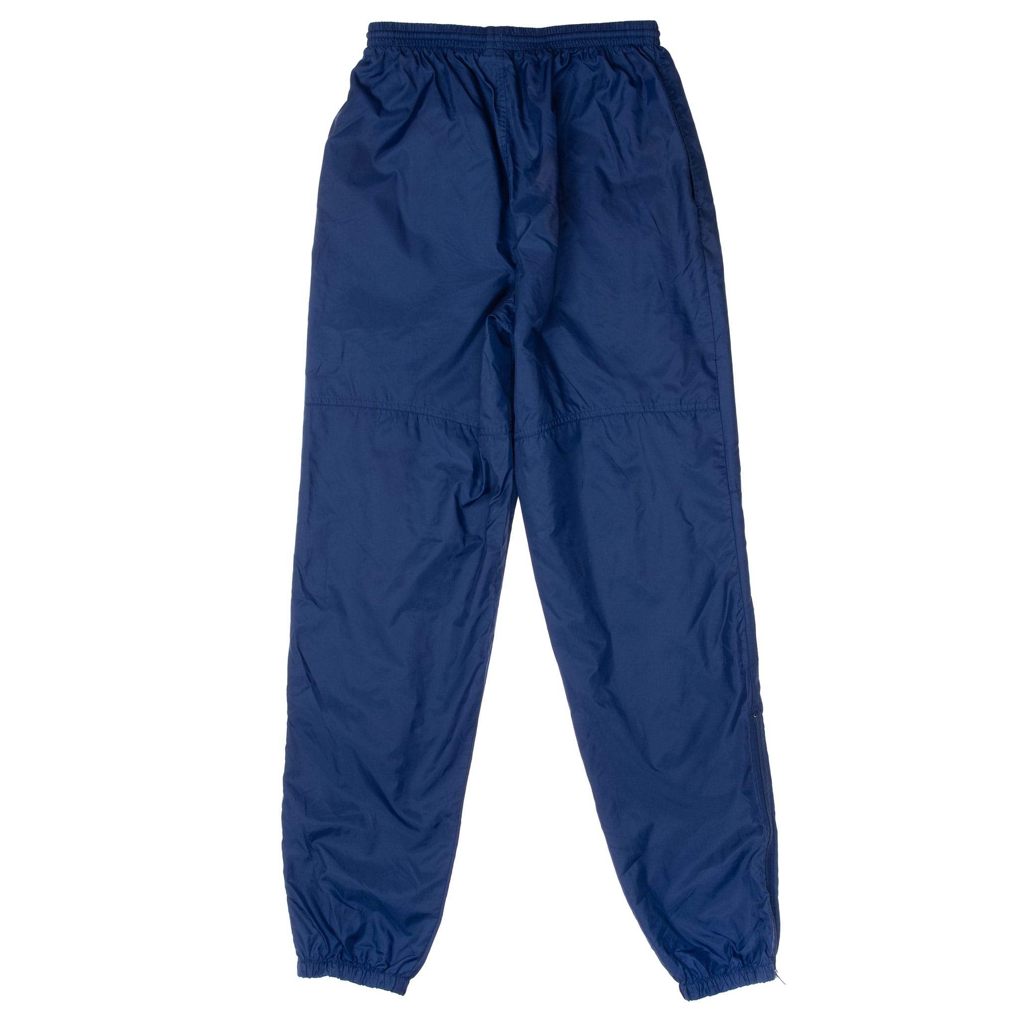 Back of navy blue Nike track pants with articulated knee seams and elastic cuffs
