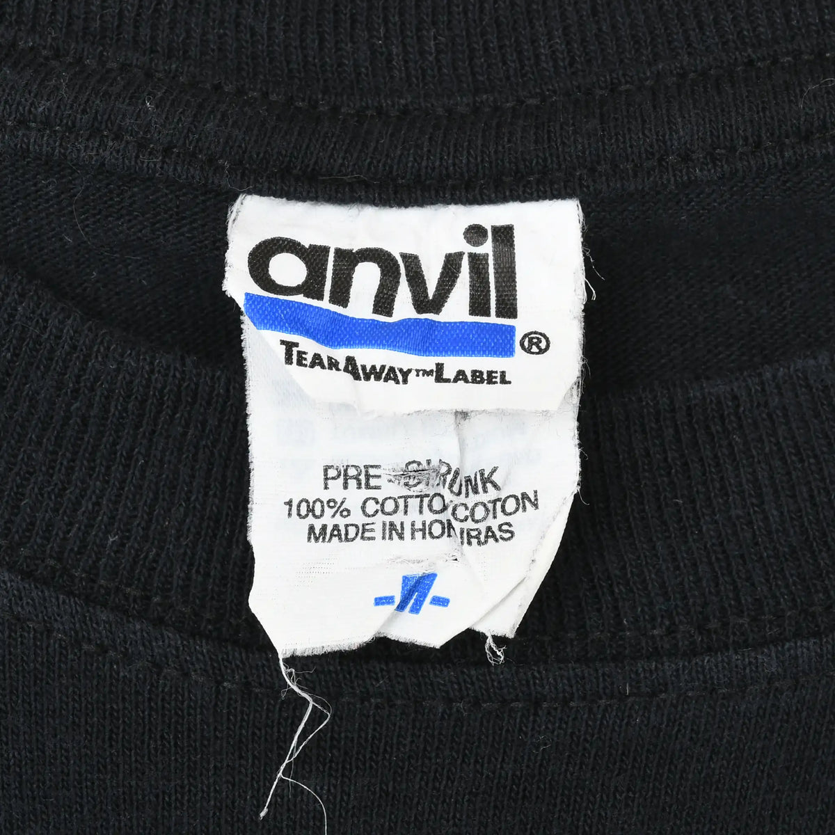Close-up of Anvil Tear Away neck label inside black Otep T-shirt