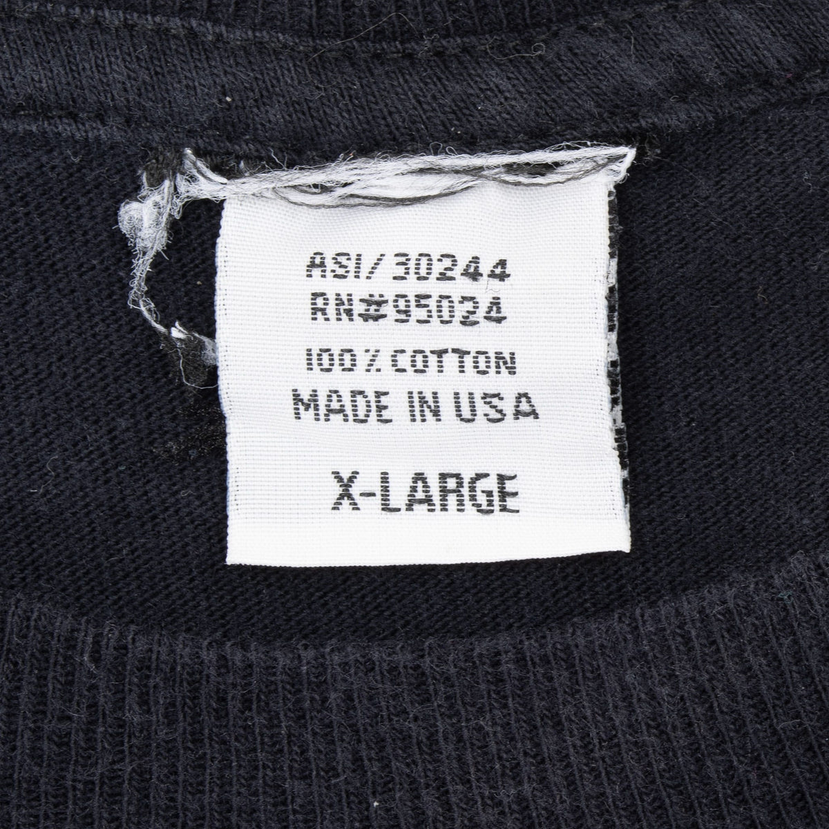 Neck tag showing 100% cotton, made in USA and size X-Large