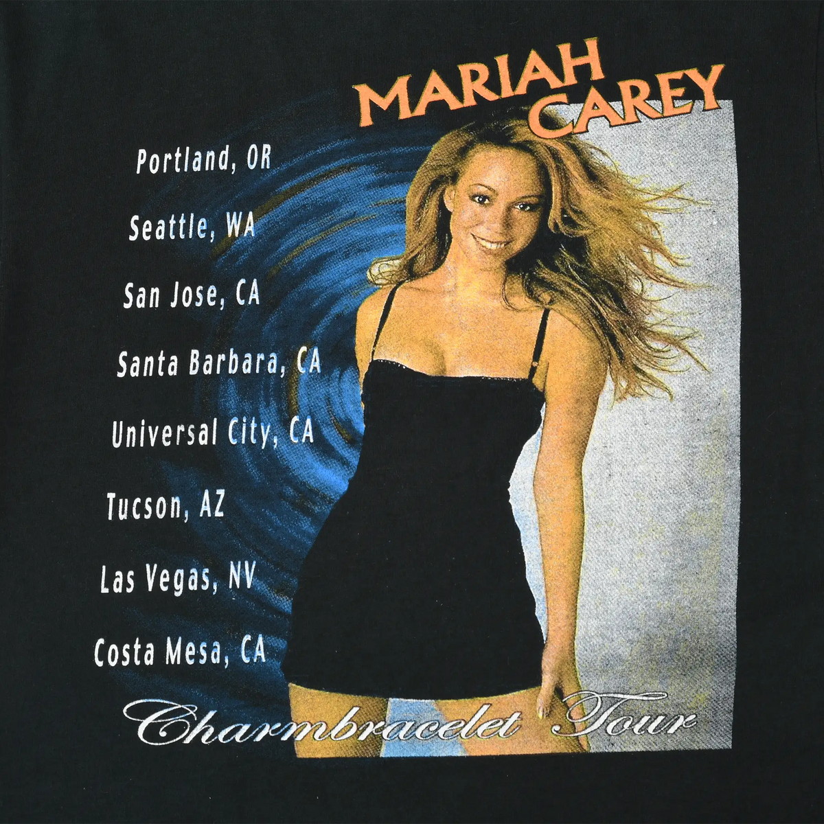 Close-up of back Mariah Carey tour graphic with portrait and city list