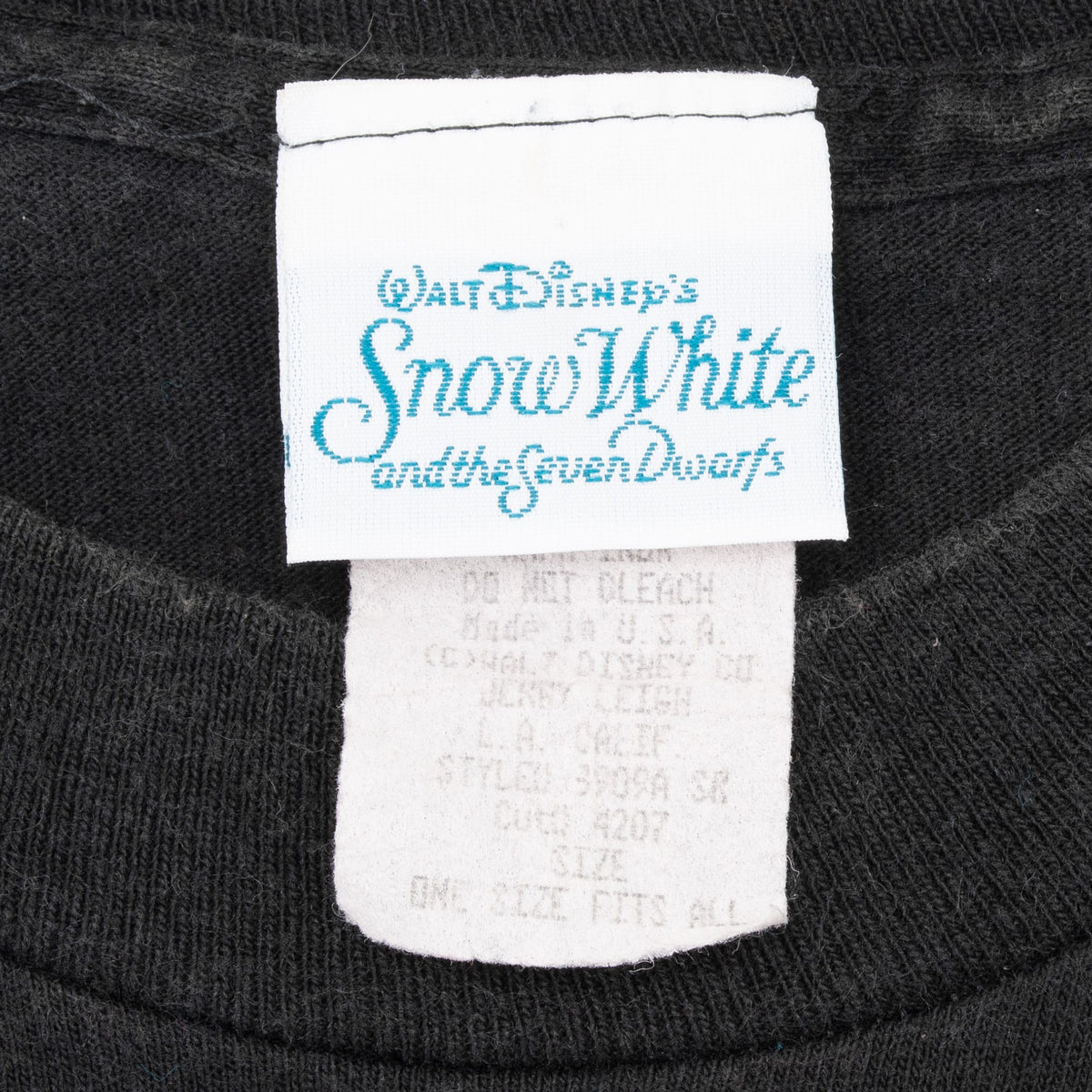 Walt Disney's Snow White and the Seven Dwarfs neck tag and faded care label